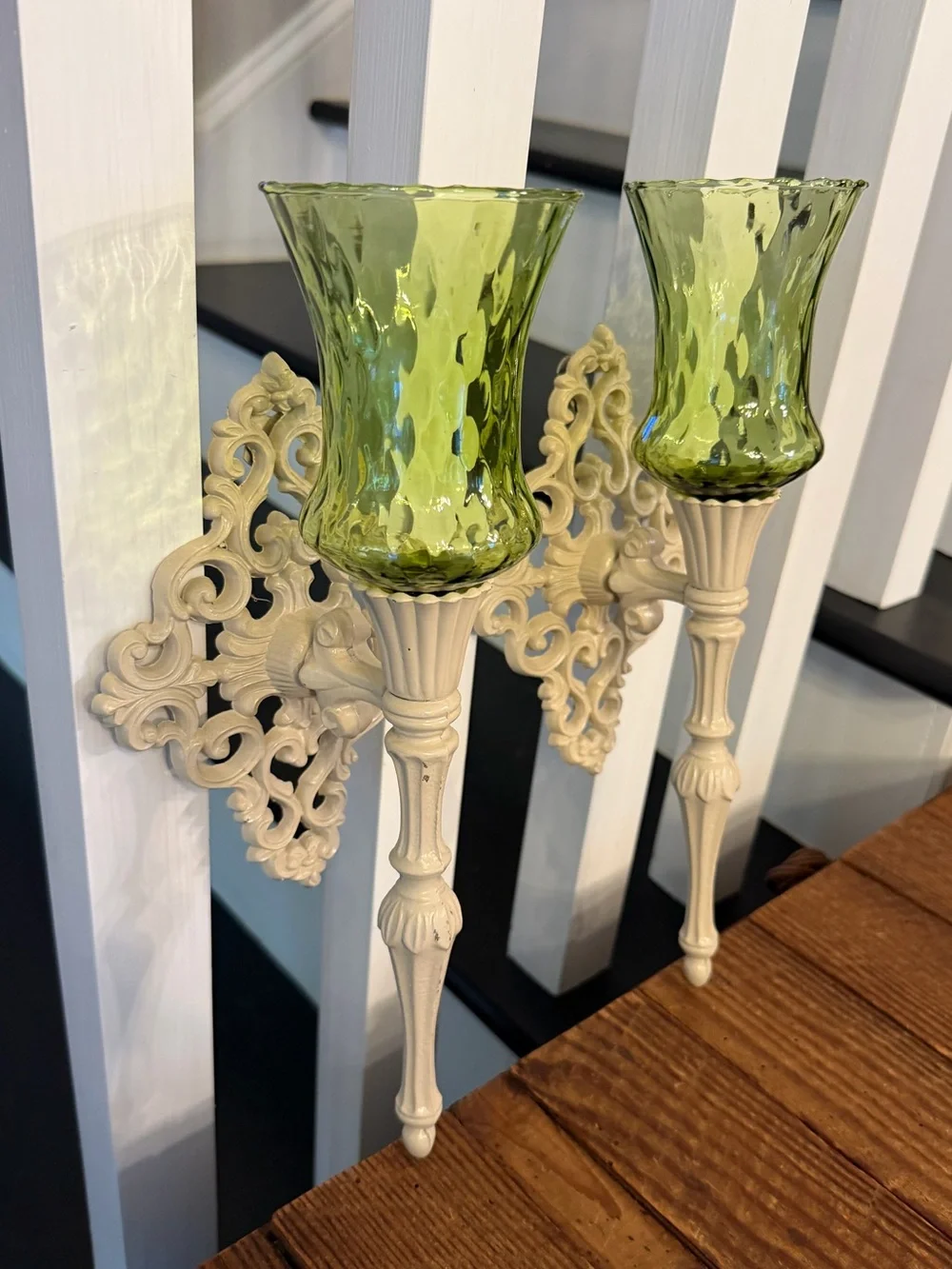 (2) vintage cast metal candle wall sconces paired with green glass votive cups